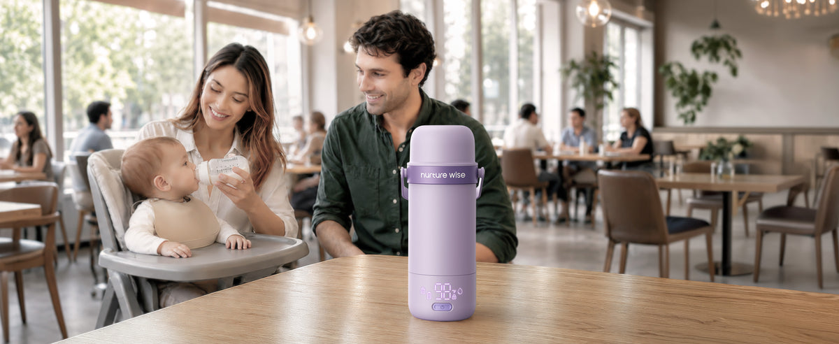 Family feeds baby at restaurant with purple warmer on table